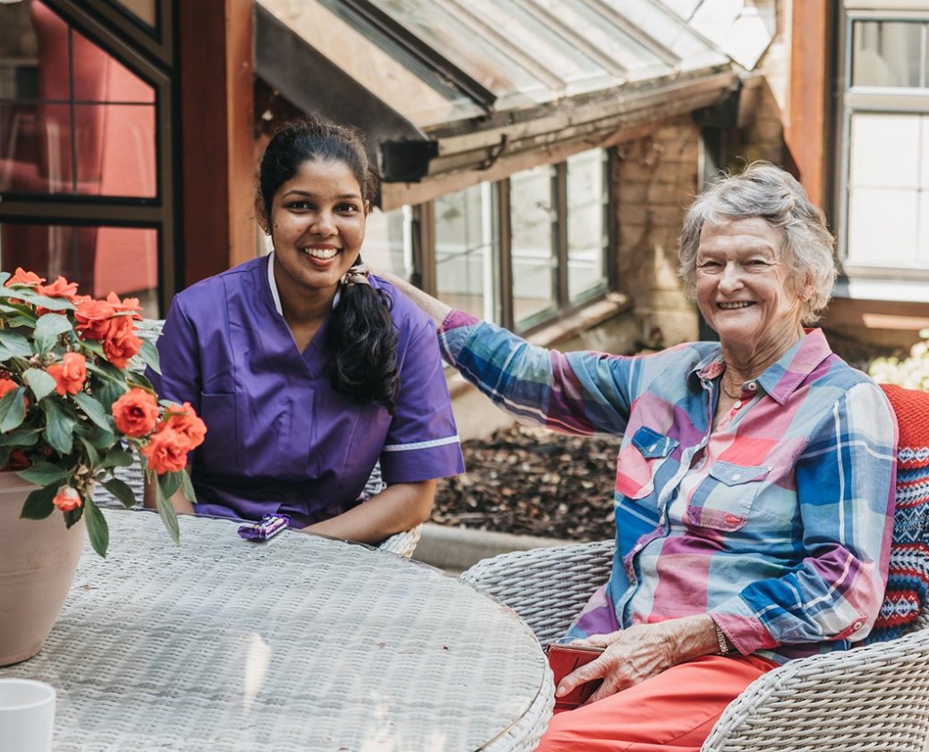 Carer and Resident sitting outside