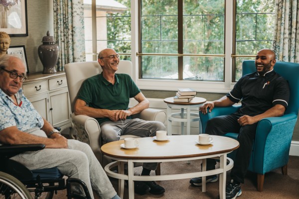 Residents and Staff at Kingman House Relaxing in one of the Sitting Rooms